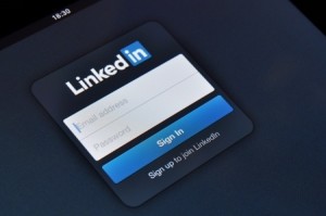 A screen displaying the LinkedIn sign-in page with fields for email address and password. Below the fields, there's a blue "Sign In" button and a clickable link that reads "Sign up to join LinkedIn" to create an account.