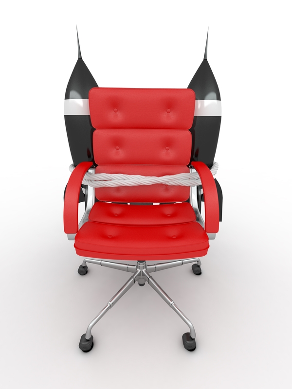 A modern red office chair equipped with jet engines attached to its backrest, giving it a futuristic appearance, perfect for any high-flying job. The chair features armrests and sits on a wheeled base, all set against a plain white background.