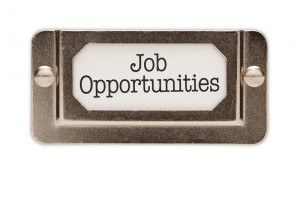 A metallic label holder with a white insert displaying the text "Job Opportunities" in black letters, providing a clear and professional presentation for potential candidates.