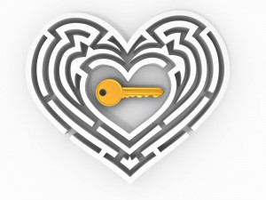 A gold key rests in the center of a heart-shaped maze. The maze is white with intricate, curving paths leading toward the key at its core, symbolizing finding the key to someone's heart through passion. The background is plain white.