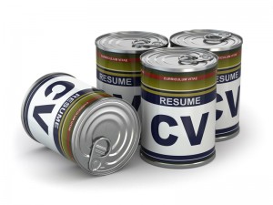 Four tin cans with labels reading "RESUME" and "CV" are arranged in a cluster, designed to resemble canned food with colorful labels and metallic tops. The image suggests the idea of pre-packaged resumes, perfectly highlighting the convenience of having your credentials ready at any time.