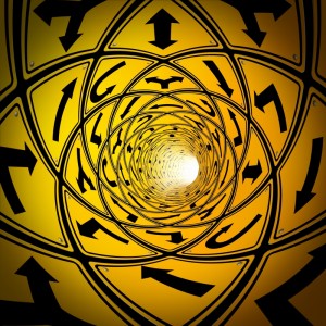A swirling tunnel-like pattern of yellow road signs with various black arrow directions, converging towards a bright white center. The dynamic arrows symbolize employee retention strategies, pointing in multiple directions to create a sense of movement and depth.