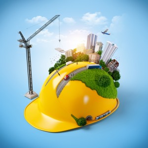 A surreal image of a yellow hard hat with a miniature cityscape on top, revealing an untapped world. The city includes buildings, greenery, construction crane, vehicles, and a plane flying above. The background is a clear blue sky with a glow of sunlight in the center.