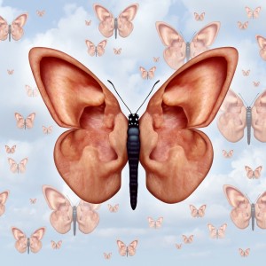 A surreal image of a butterfly with human ears for wings, set against a cloudy sky background. Similar smaller butterflies with ear-wings are scattered in the background, creating a dreamlike and whimsical scene that invites contemplation and learning about the boundaries of imagination.