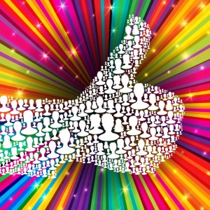 A vibrant image features a large thumbs-up symbol, reminiscent of LinkedIn's logo, made up of numerous smaller white silhouettes of heads against a background of radiating, colorful rainbow beams with sparkling highlights.