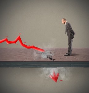 A businessman in a suit stands on a cracked floor, observing a red, jagged arrow crashing through. The arrow symbolizes a sharp economic or financial decline, jeopardizing jobs. Dust and debris scatter around the breaking point, emphasizing the sudden drop.