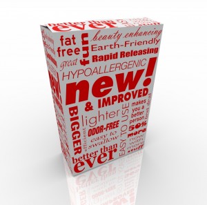 A product packaging featuring various promotional words in red on a white box. Text includes phrases like "new! & improved," "Earth-Friendly," "fat free," "lighter," "odor-free," "hypoallergenic," and "BIGGER GOVERNMENT" among others, in different fonts and orientations.