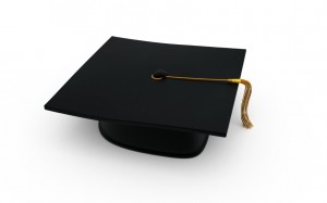 A black graduation cap with a yellow tassel, symbolizing the achievement of an MPA, placed on a white background.