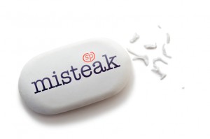 A white eraser with the word "misteak" printed on it in bold, black letters sits on a plain white background. The word "misteak," a humorous misspelling of "mistake," perfectly encapsulates the irony. The well-used eraser has small shavings scattered around it, symbolizing every revision to your resume.