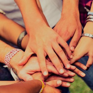 People putting hands together