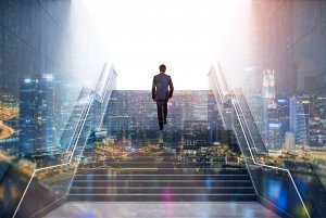 A person in a suit ascends a modern staircase toward a bright white light, symbolizing leadership. The scene blends with a bustling cityscape at night, featuring illuminated skyscrapers and urban lights, giving a surreal and futuristic vibe.