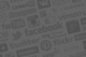A blurred background is filled with multiple logos of popular social media platforms and websites, including Facebook, Twitter, LinkedIn, YouTube, Instagram, Pinterest, Flickr, Tumblr, and others. The logos are grey-toned and overlap each other.