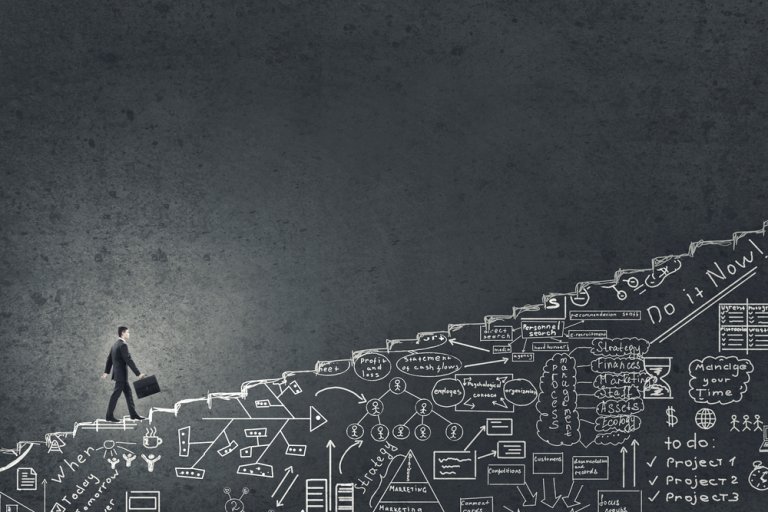 A person in business attire climbs a set of stairs, carrying a briefcase. The stairs, filled with various business-related doodles and diagrams, symbolize the complex plans and strategies essential to a successful career. The background is dark and has a textured surface.