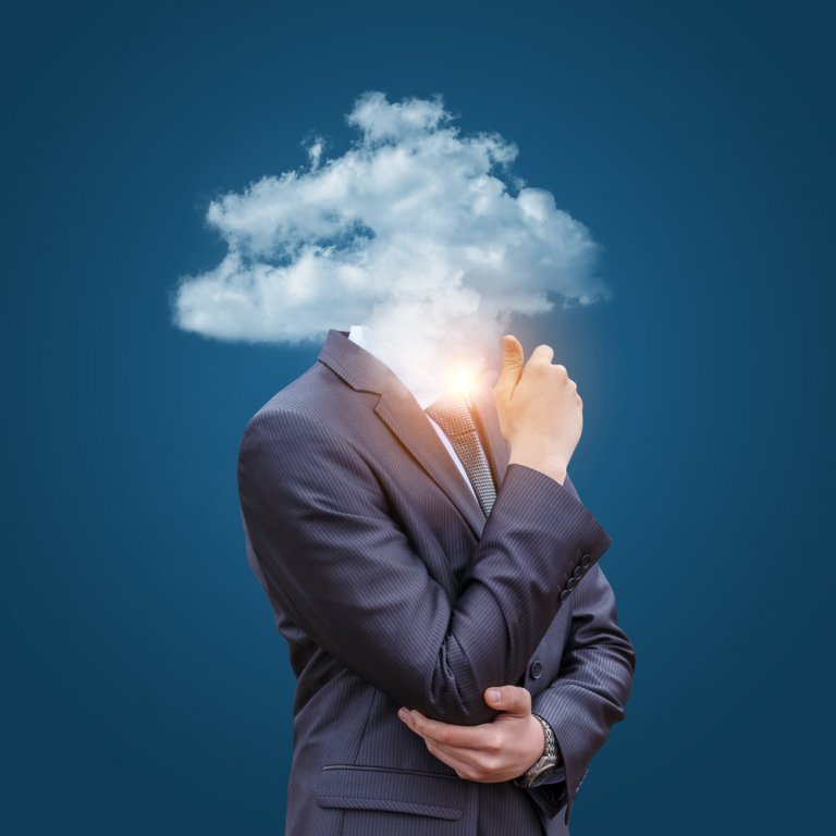 A man in a suit and tie stands with his hand on his chin, as if thinking. Instead of a head, he has a cloud with sunlight shining through the middle, suggesting a promoted sense of enlightenment. The background is a solid blue color.