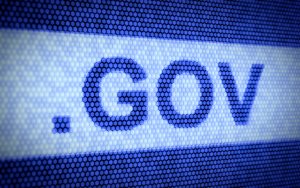 A digital graphic featuring the text ".GOV" in bold, uppercase letters. The background consists of a blue-toned honeycomb pattern, giving the image a modern, tech-inspired appearance.
