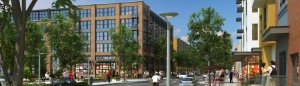A bustling urban street scene with mid-rise apartment buildings flanking both sides. People walk along the sidewalks, some sit at outdoor cafes, and a few cars are parked along the street. Trees and streetlights line the road, creating a vibrant, lively atmosphere.