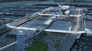 An aerial view of LAX reveals a modern-designed airport terminal with a central futuristic building featuring unique architecture. The image shows multiple parking areas, illuminated walkways, and several airplanes on the tarmac in the background, with a control tower nearby.