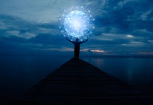 A person stands at the end of a pier, arms raised towards a glowing, interconnected globe in the sky, set against a twilight backdrop of dark clouds and calm waters, symbolizing digital transformation.