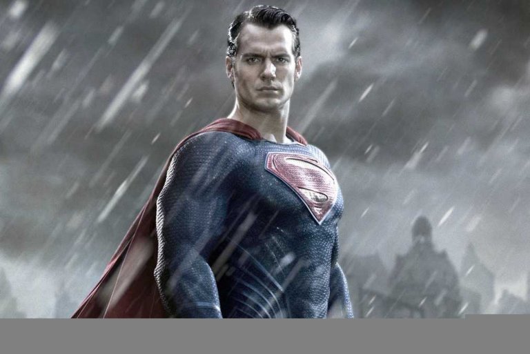A figure dressed as Superman stands heroically in the rain, exuding leadership in a blue suit with the iconic red and yellow 'S' emblem on his chest and a red cape. The dark and stormy background heightens the dramatic effect of the scene.
