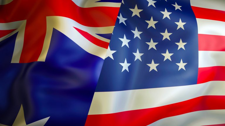 A blended image of the Australian and American flags, symbolizing strong relationships, with the upper left showcasing the Union Jack and stars from Australia's flag, while the right side features the iconic stars and stripes of the United States flag.