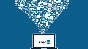 Illustration of a laptop with the LinkedIn logo on its screen. Above the device, a funnel-shaped cluster of white icons representing communication, networking, and social media converges, symbolizing information flow into LinkedIn. Set against a blue background.
