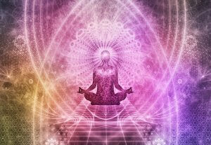 A silhouette of a person in a lotus position, surrounded by intricate, vibrant patterns and radiant colors. The image conveys a sense of meditation and potential spiritual energy, with emanating light and abstract designs creating an ethereal and calming atmosphere.