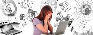 A woman sits at a desk with her head in her hands in front of a laptop. The background is filled with various black and white sketches depicting the pressures of modern life, such as technology, business, social media, money, and the role of family responsibilities.