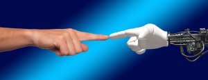 A human hand and a robotic hand, embodying artificial intelligence, are about to touch fingers against a blue gradient background, evoking the iconic imagery of Michelangelo's "The Creation of Adam" from the Sistine Chapel ceiling.