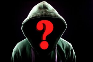A person wearing a green hoodie is depicted against a dark background, evoking an air of mystery with their face obscured by a large red question mark. The hoodie’s drawstrings dangle in front, adding to the casual appearance, subtly hinting at themes of data protection and anonymity.