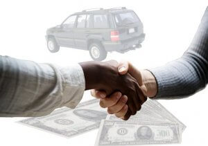 Two people shaking hands in the foreground with U.S. dollar bills and a green SUV in the background, suggesting a transaction or an agreement related to purchasing or selling a vehicle. The scene conveys a successful deal, boosting their self-esteem with this accomplished negotiation.