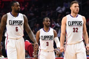 Three basketball players in LA Clippers uniforms are on a basketball court, building brand excitement. The player on the left wears jersey number 6, the player in the center wears jersey number 3, and the player on the right wears jersey number 32. They appear focused and ready for action.