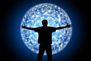 Silhouette of a person standing with arms outstretched in front of a large, glowing network sphere. The sphere features interconnected lines and nodes, creating a web-like structure. The background is a gradient of deep blue to black, highlighting the illuminated sphere, symbolizing leadership in the digital realm.