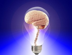 Image of a light bulb with a human brain inside it, set against a blue gradient background. The glowing light bulb symbolizes the concept of ideas, creativity, intelligence, and makes you ponder: *What do you know* about the power of thought?