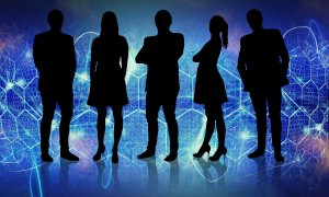 Silhouettes of five people stand confidently against a futuristic, blue-toned background with hexagonal patterns and digital elements. The figures, including both men and women, are backlit, highlighting their professional attire and varied stances, embodying the strength behind strategic decisions.