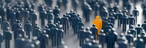 A large crowd of stylized, abstract human silhouettes in shades of blue fills the image. Among them, one figure is highlighted in bright orange, standing out prominently from the rest. The image symbolizes individuality and uniqueness amid a crisis-ridden crowd.