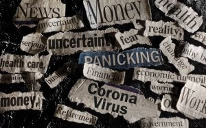 A collage made of torn newspaper headlines related to the COVID-19 pandemic features words like "News," "Money," "unprecedented," "uncertainty," "panicking," "health," "financial stress,” “Coronavirus,” and “fear” scattered across a dark background.