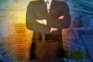 A person in a suit stands with arms crossed in front of a background filled with stacks of gold coins and large images of U.S. hundred-dollar bills, representing successful financial habits. The image blends finance and business themes with a subtle cityscape overlay at the bottom.