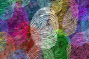 A vibrant and abstract artwork featuring overlapping, colorful fingerprints that subtly evoke themes of online privacy. The fingerprints vary in size and color, including shades of red, blue, green, yellow, pink, and purple, creating a textured and dynamic composition with intricate swirling patterns.