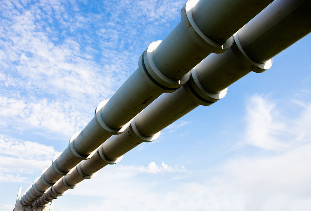 Elevated,Section,Of,The,Pipelines,Against,The,Cloudy,Sky