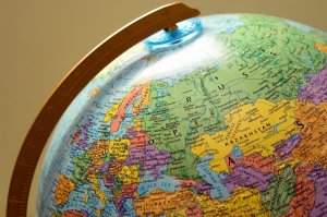 A brightly colored globe showcasing various countries, including parts of Europe and Asia. Featuring a yellow meridian, it highlights Russia, Poland, Ukraine, Romania, and Kazakhstan among other nations, providing an international perspective.