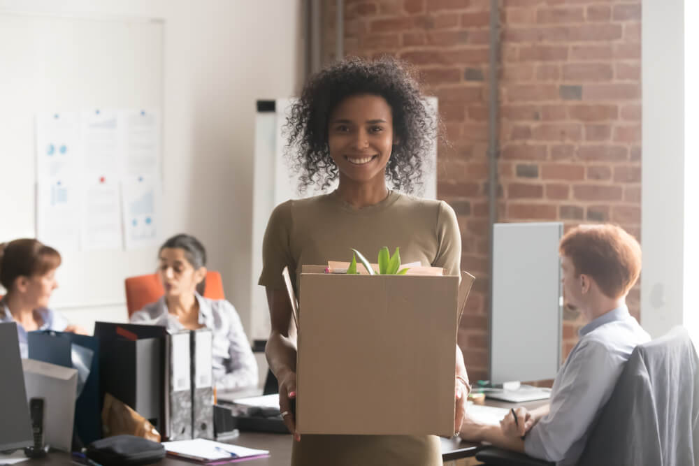 Happy,Young,African,Female,Employee,Intern,Holding,Cardboard,Box,Looking leadership