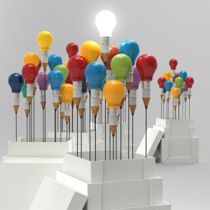 Several colored pencils with light bulb tops are arranged in open white boxes, with one bulb illuminated in the front box, symbolizing leadership. Additional groups of these pencil-bulbs extend into the background, creating an innovative and creative scene.