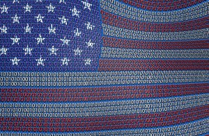 An image of the United States flag composed of binary code. The stars and stripes are depicted using patterns of 0s and 1s in red, white, and blue colors, representing a digital or technological theme that echoes modern governments' reliance on technology.
