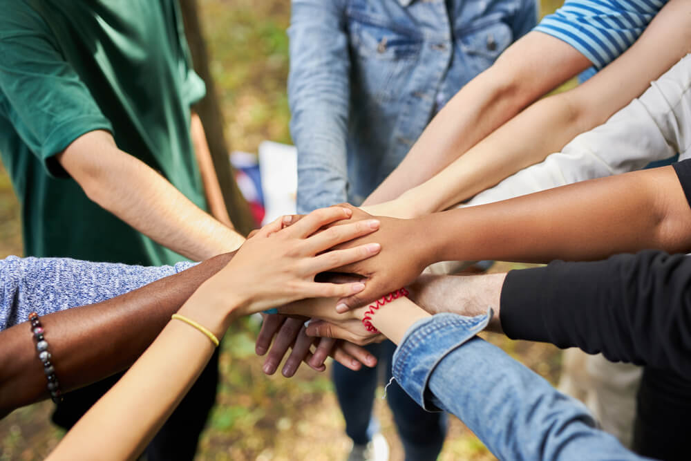 Mixed,Race,International,Group,Of,Young,People,Gathered,Outdoors,,They