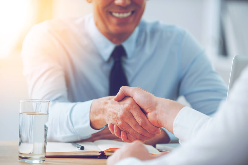 Good,Deal.,Close-up,Of,Two,Business,People,Shaking,Hands,While women's leadership
