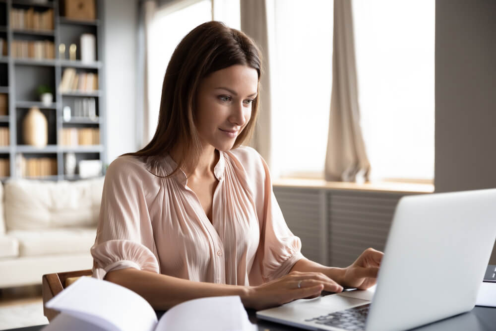 Head,Shot,Pleasant,Happy,Young,Woman,Freelancer,Working,On,Computer