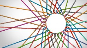 Colorful ropes interwoven and extending outward from a central void, creating a circular pattern. The ropes are in various colors—including red, blue, green, purple, and orange—symbolizing connectivity, unity, and integrity. The background is plain white.