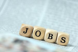 Wooden dice forming a word ‘JOBS’