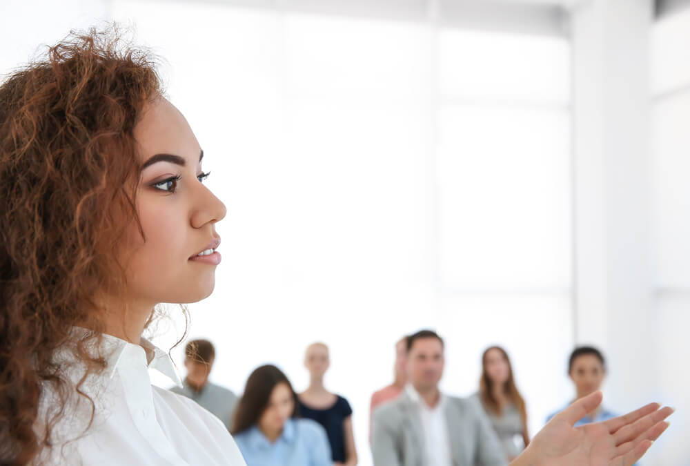 Business,Trainer,Giving,Presentation,To,Group,Of,People