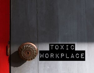 A door with a text on saying ‘Toxic Workplace’